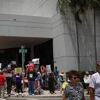 ‘100 days of nothing but chaos’: Miami protesters speak against Trump